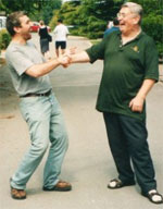 Tim Reynish laughing with a student