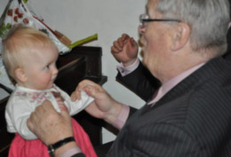 Image of Tim Reynish with his granddaughter